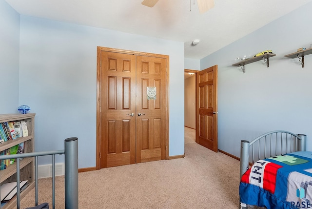 carpeted bedroom featuring visible vents, a ceiling fan, and baseboards