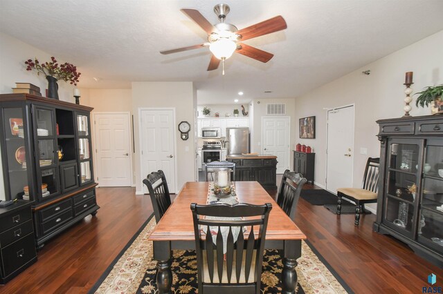 7434 S Louise Ave Unit 103, Sioux Falls, SD 57108 - dining space with ceiling fan, visible vents, baseboards, and dark wood-style floors