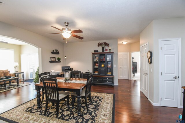 7434 S Louise Ave Unit 103, Sioux Falls, SD 57108 - dining room featuring dark wood-type flooring, baseboards, arched walkways, and ceiling fan