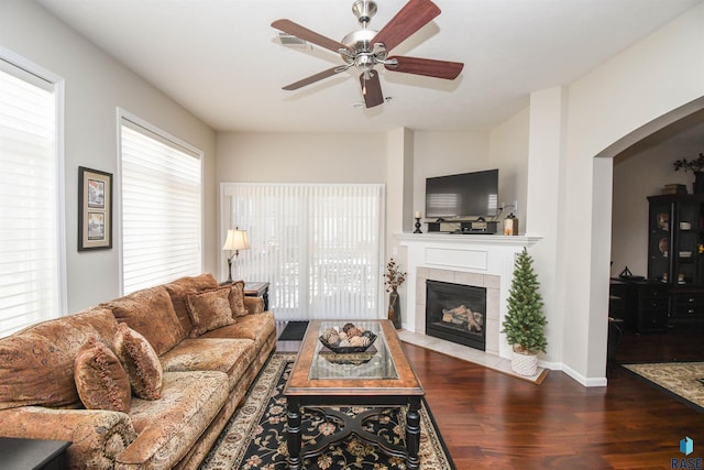 7434 S Louise Ave Unit 103, Sioux Falls, SD 57108 - living area with a tile fireplace, a ceiling fan, baseboards, and wood finished floors
