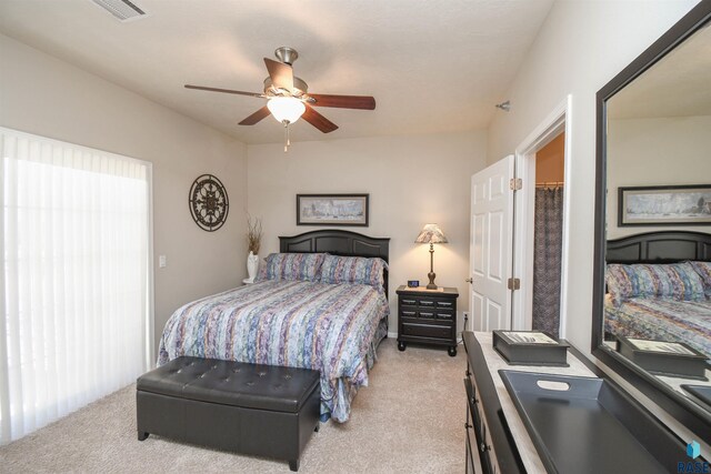 7434 S Louise Ave Unit 103, Sioux Falls, SD 57108 - bedroom with visible vents, light colored carpet, and ceiling fan