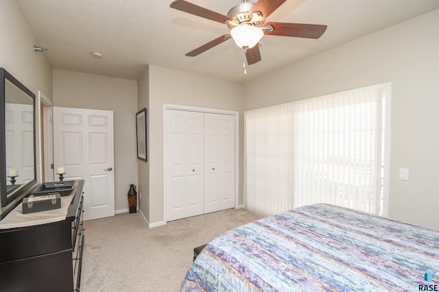 7434 S Louise Ave Unit 103, Sioux Falls, SD 57108 - bedroom featuring a closet, baseboards, light colored carpet, and ceiling fan
