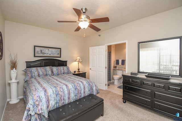 7434 S Louise Ave Unit 103, Sioux Falls, SD 57108 - bedroom featuring a ceiling fan, baseboards, light colored carpet, and ensuite bathroom