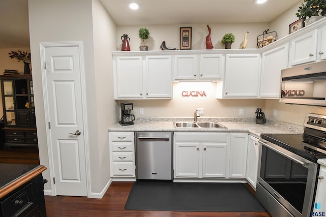 7434 S Louise Ave Unit 103, Sioux Falls, SD 57108 - kitchen featuring dark wood-type flooring, a sink, white cabinetry, recessed lighting, and stainless steel appliances