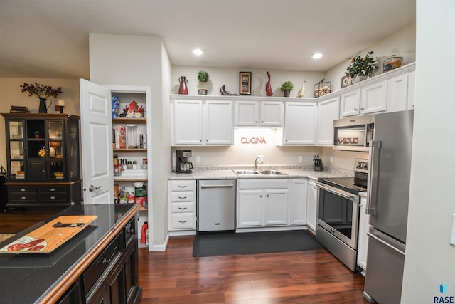 7434 S Louise Ave Unit 103, Sioux Falls, SD 57108 - kitchen with a sink, dark wood-type flooring, appliances with stainless steel finishes, and white cabinets