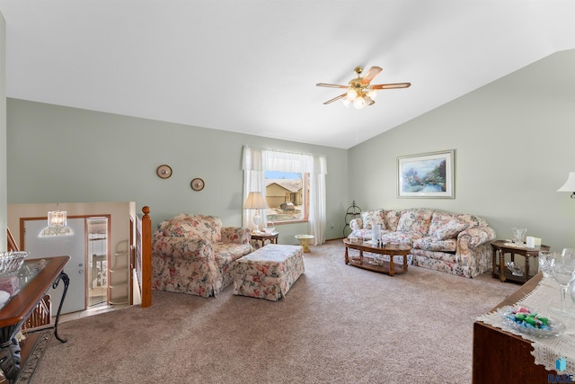 living room featuring carpet, a ceiling fan, and vaulted ceiling