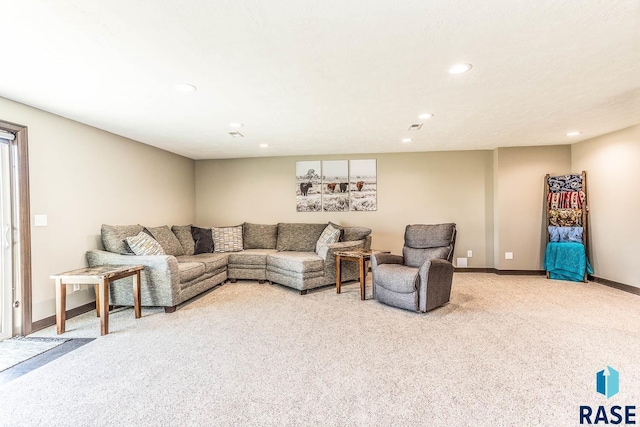 living area featuring visible vents, recessed lighting, light colored carpet, and baseboards