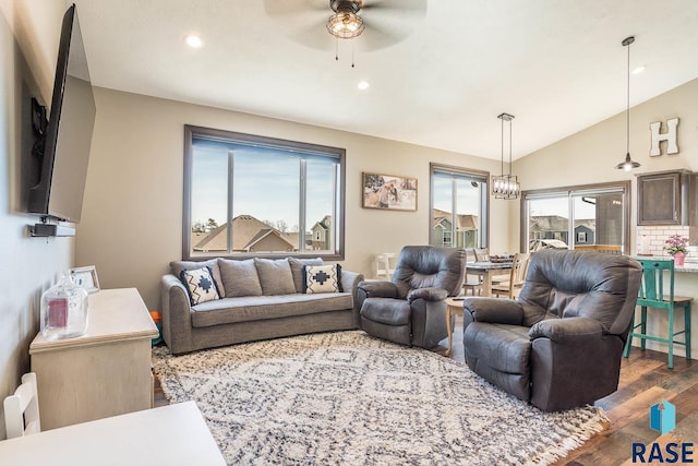 living area featuring a ceiling fan, lofted ceiling, recessed lighting, and wood finished floors