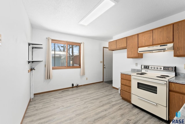 kitchen featuring electric stove, under cabinet range hood, a textured ceiling, light wood-style floors, and brown cabinetry