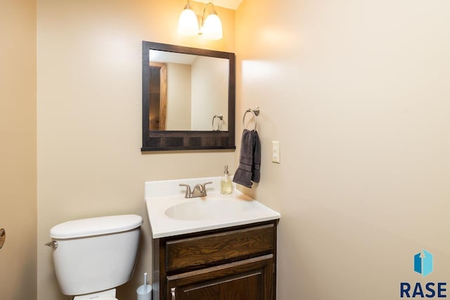 half bath with vanity and toilet