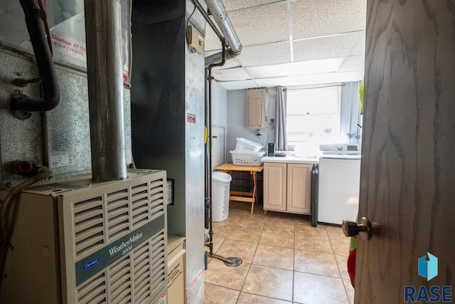 interior space featuring heating unit and washer / dryer