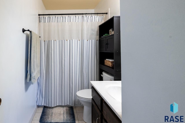 full bath featuring curtained shower, toilet, vanity, and tile patterned flooring