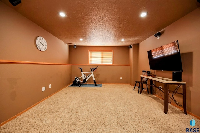 workout room featuring recessed lighting, baseboards, carpet floors, and a textured ceiling