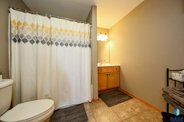 bathroom with tile patterned flooring, baseboards, toilet, a shower with curtain, and vanity