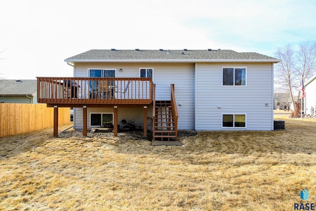 rear view of property featuring stairway, cooling unit, a wooden deck, and fence