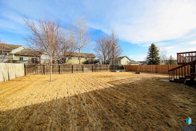 view of yard with a fenced backyard