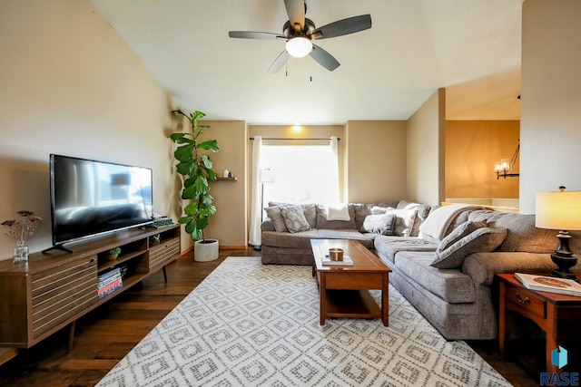 living room featuring a ceiling fan and wood finished floors