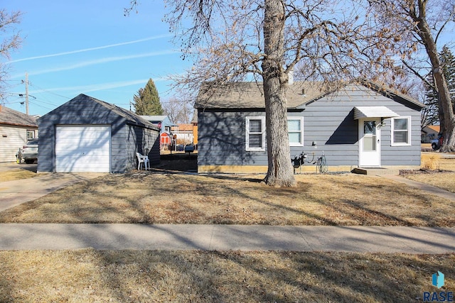 view of front of house with an outbuilding and driveway