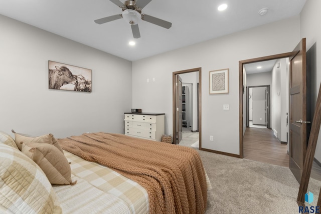 bedroom with light carpet, recessed lighting, a ceiling fan, and baseboards