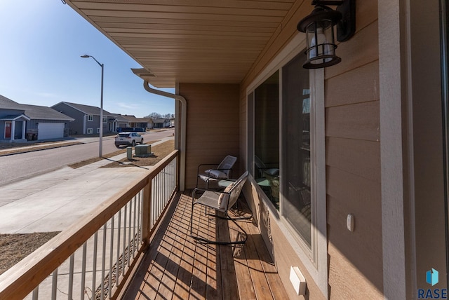 balcony with a residential view and a sunroom