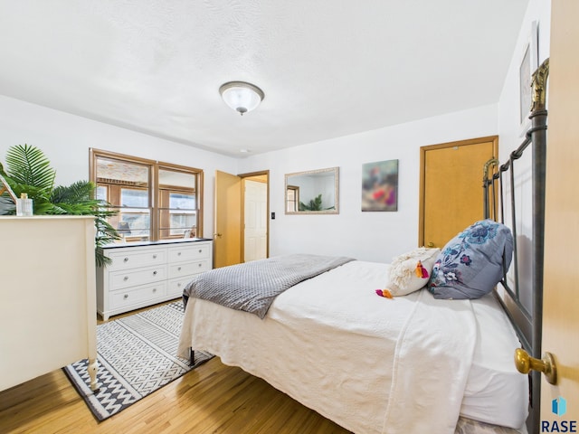 bedroom featuring wood finished floors