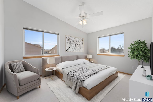 bedroom with ceiling fan, baseboards, lofted ceiling, and carpet floors