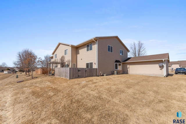 view of property exterior featuring fence