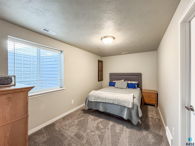 bedroom featuring carpet, visible vents, and baseboards