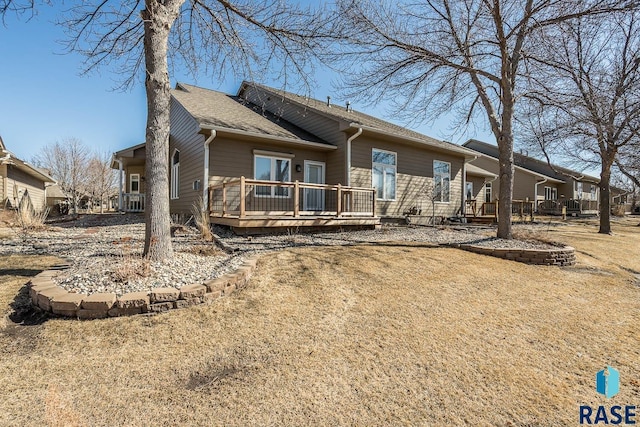 rear view of house with a wooden deck