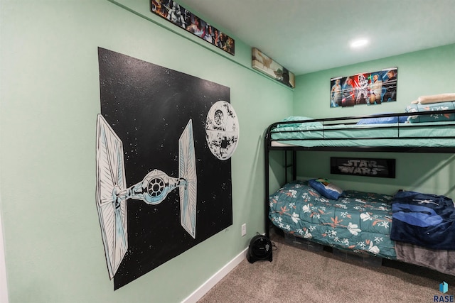 bedroom featuring baseboards and carpet floors