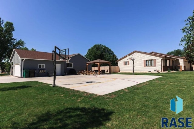 view of sport court with a gazebo and a lawn