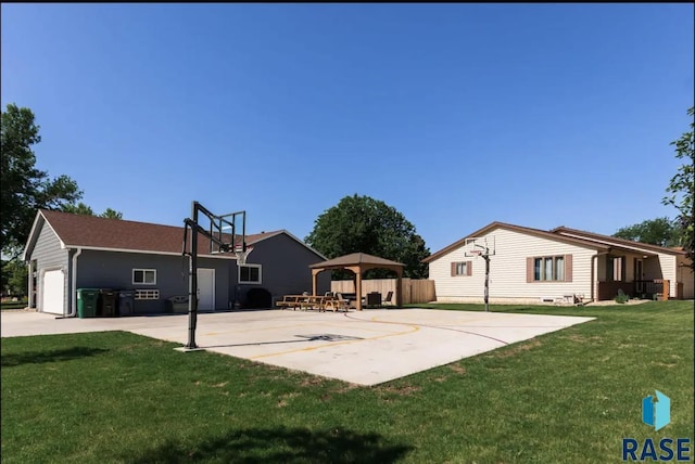 view of sport court with a gazebo, a yard, and basketball court