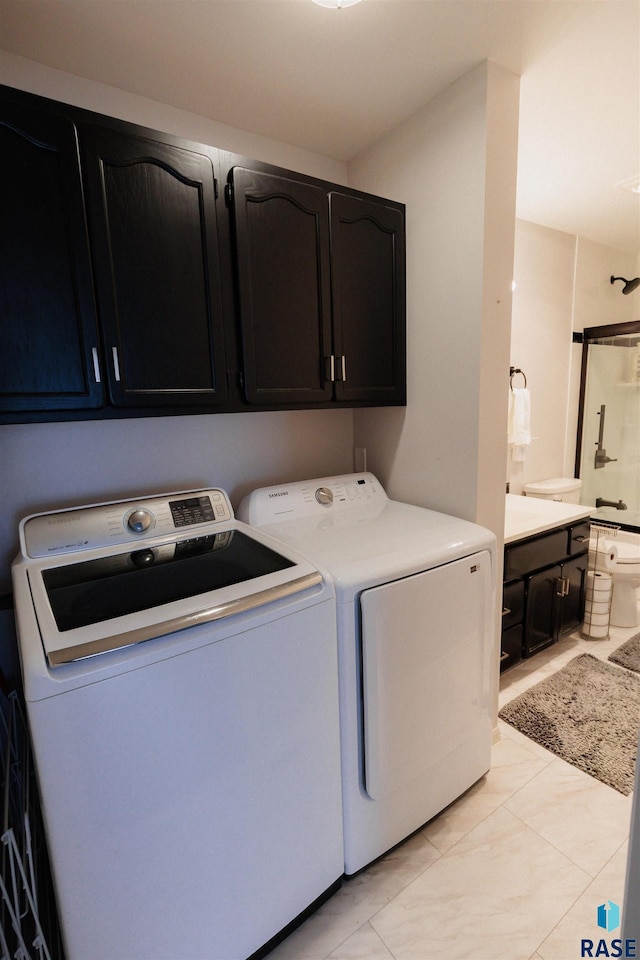 washroom featuring independent washer and dryer and laundry area