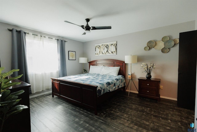 bedroom featuring ceiling fan, baseboards, and wood finished floors