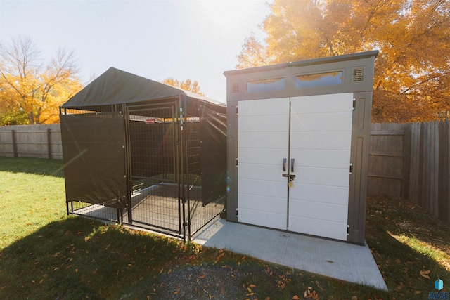 view of outbuilding featuring an outbuilding and a fenced backyard