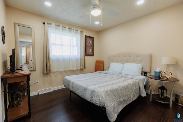 bedroom featuring recessed lighting, wood finished floors, visible vents, and baseboards