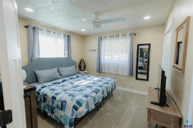 bedroom featuring recessed lighting, baseboards, light carpet, and a ceiling fan