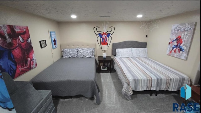 bedroom with recessed lighting, carpet, and a textured ceiling