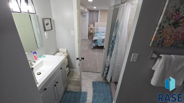 full bathroom featuring a shower with shower curtain, recessed lighting, vanity, and tile patterned floors