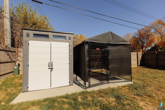 view of outbuilding featuring an outbuilding and a fenced backyard