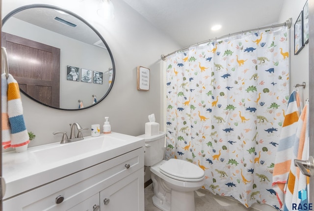 bathroom featuring a shower with curtain, toilet, and vanity