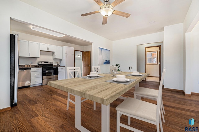 dining area with baseboards, dark wood-type flooring, and a ceiling fan