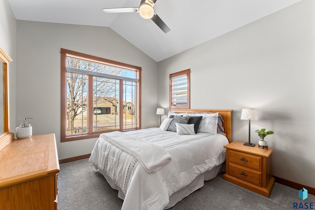 bedroom with vaulted ceiling, baseboards, dark colored carpet, and ceiling fan