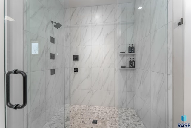 bathroom with a shower stall