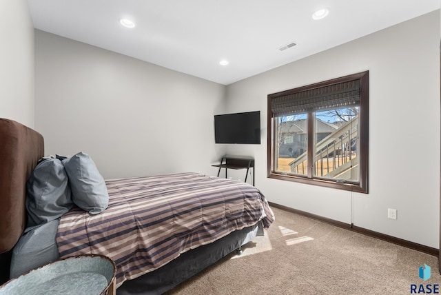 bedroom with recessed lighting, visible vents, baseboards, and light colored carpet