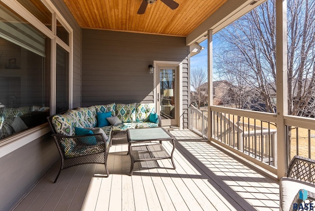 deck with an outdoor hangout area and ceiling fan