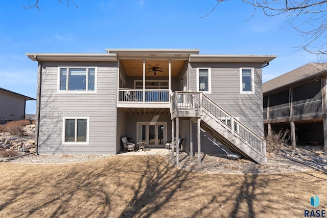 back of property featuring stairway, a patio, ceiling fan, and a sunroom