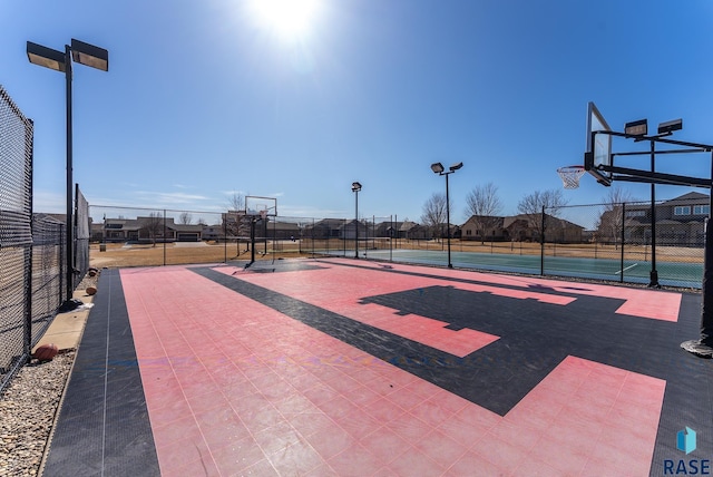 view of sport court with community basketball court and fence