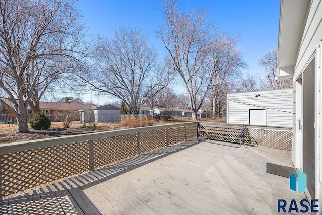 wooden terrace with a residential view