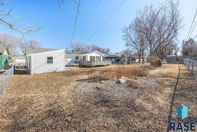 exterior space with fence private yard and a wooden deck